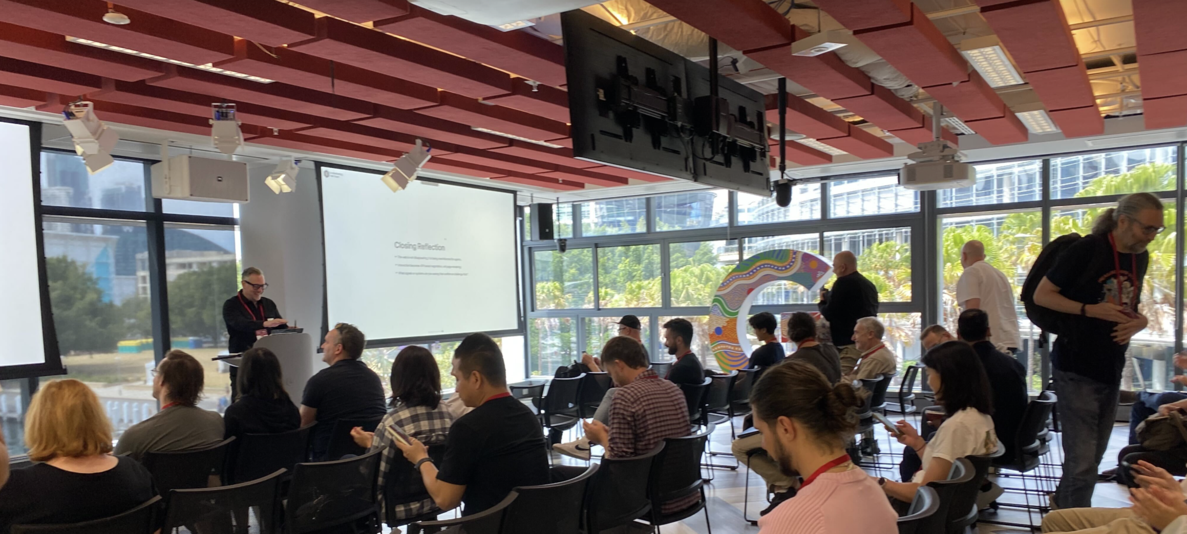 Paul Hewett presenting on the future architecture of the agentic web at MeasureCamp Sydney 2025 at Google Sydney.